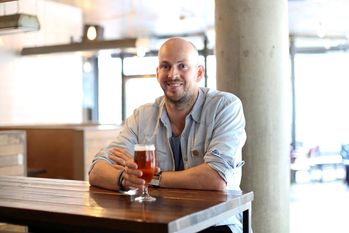 James Watt, chief executive officer of Brewdog Plc, poses for a photograph at the company's bar in Shoreditch, London, U.K., on Tuesday, Sept. 1, 2015.