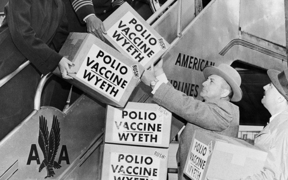 This 1955 file photo shows the first polio vaccine being shipped to Europe on an <a href="https://fortune.com/company/american-airlines-group/" target="_blank">American Airlines</a> plane.