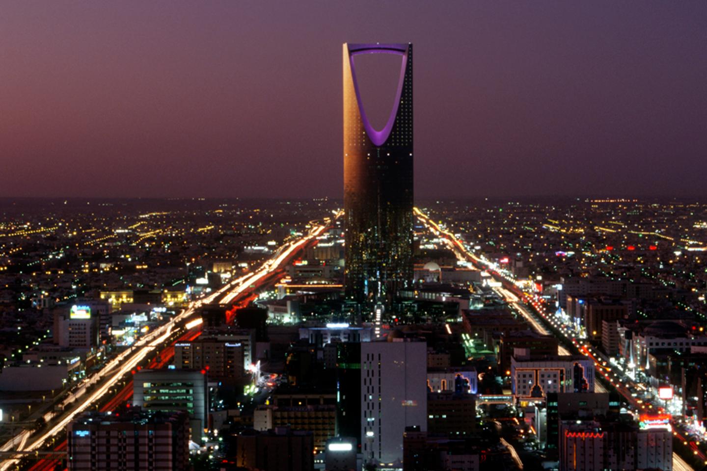 Kingdom Centre (Burj al-Mamlaka) dominates the evening cityscape  in Riyadh, Saudi Arabia.