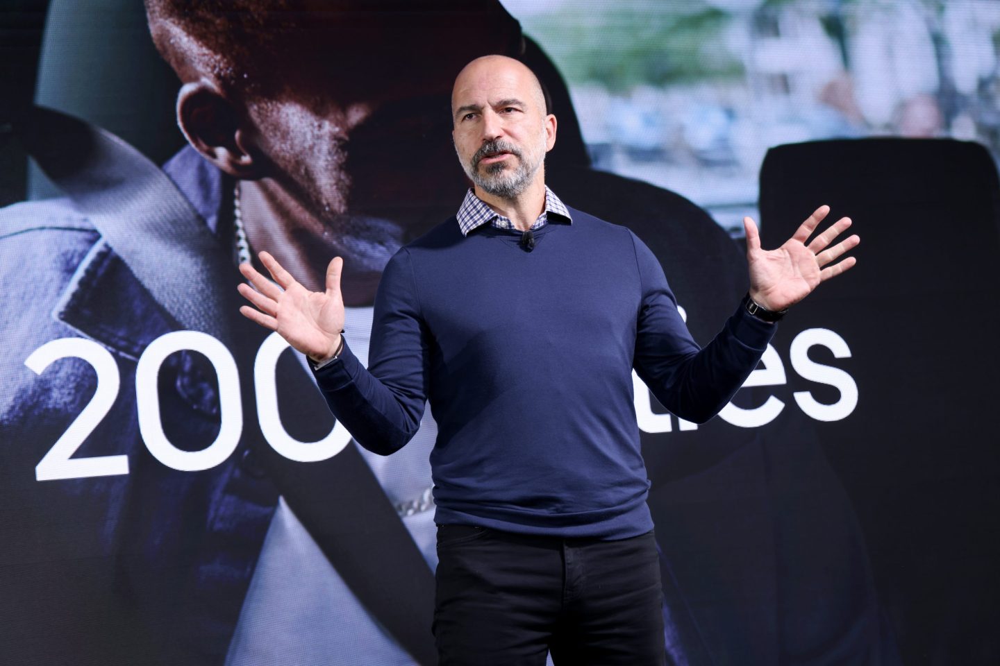 Dara Khosrowshahi, CEO of Uber, speaks at a recent event in London. Analysts have picked Uber as a top pick for 2025.