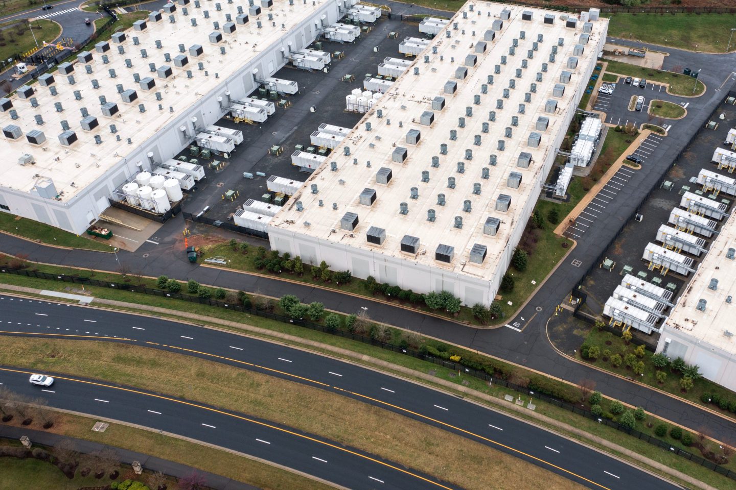 an aerial view of a sprawling amazon data center