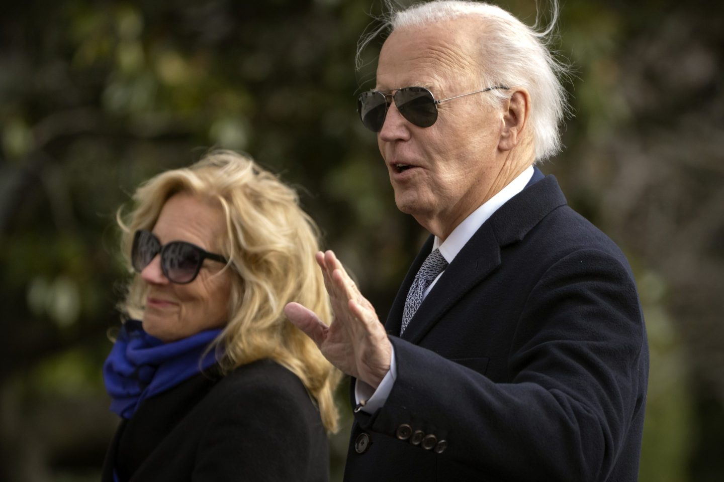President Joe Biden and first lady Jill Biden walk across the South Lawn of the White House on Thursday.