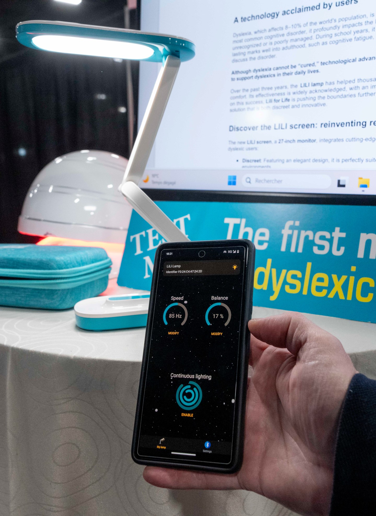 Lili showcases a reading light and monitor with adjustable frequency to help people with dyslexia during 2025 CES Unveiled, Sunday, Jan. 5, 2025, in Las Vegas.