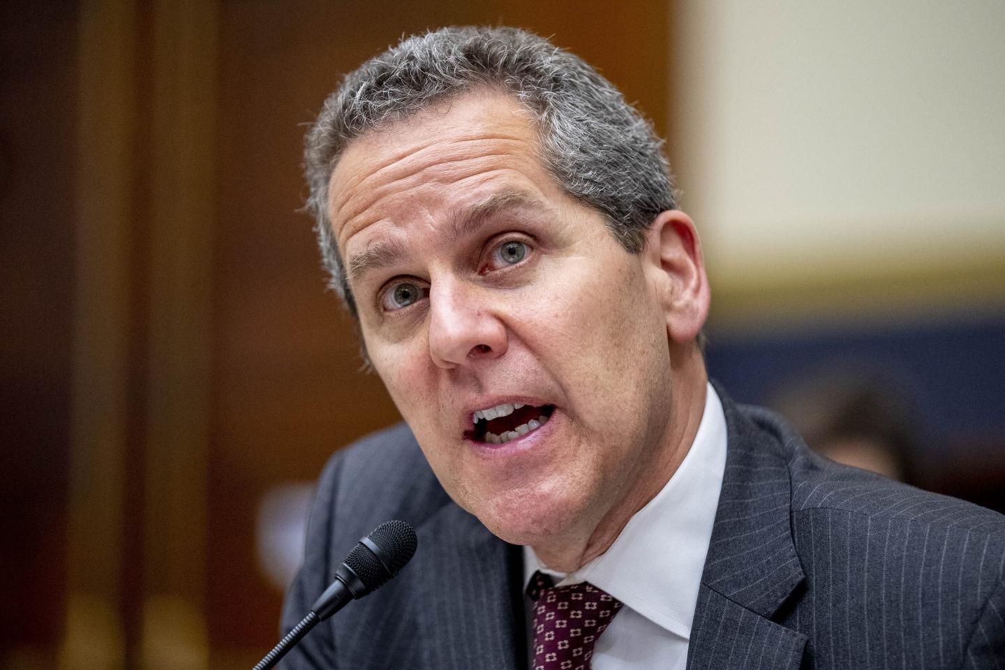 Top Fed regulator Michael Barr speaks into a microphone