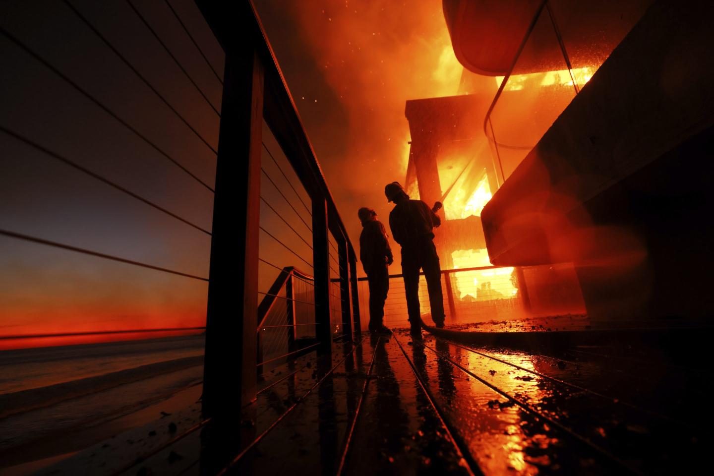 Los Angeles wildfires have already destroyed almost 2,000 homes and other buildings and forced 130,000 people to evacuate