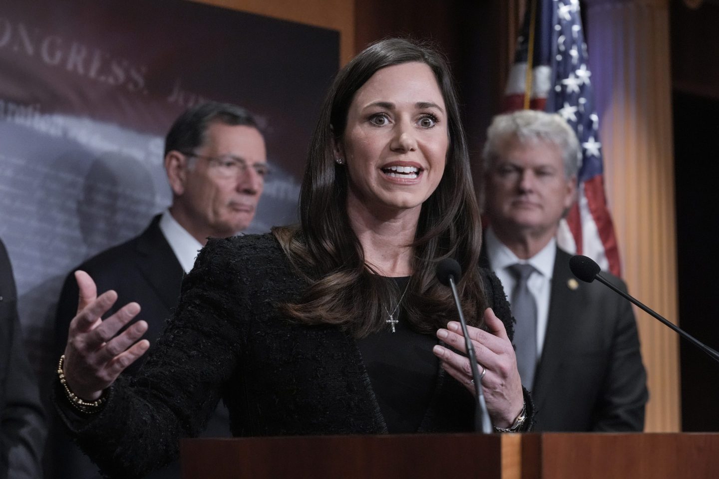 Sen. Katie Britt, R-Ala., center, is joined by Sen. John Barrasso, R-Wyo., the GOP whip, left, and Rep. Mike Collins, R-Ga., as they talk about the Laken Riley Act, a bill to detain unauthorized immigrants who have been accused of certain crimes, at the Capitol in Washington, on Jan. 9, 2025.
