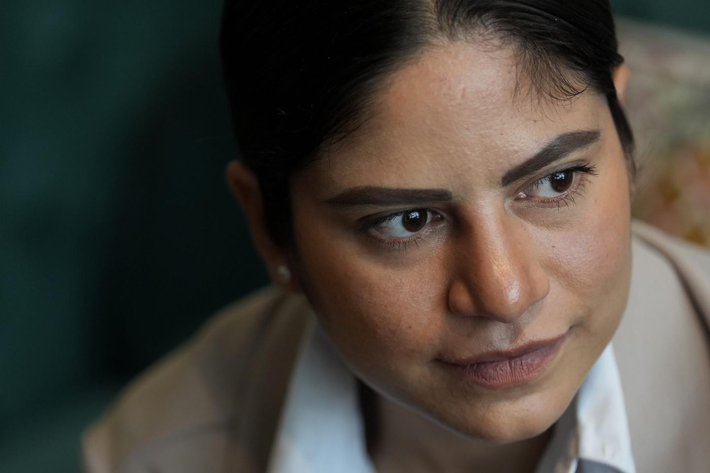 A woman from Nicaragua stares off into the distance