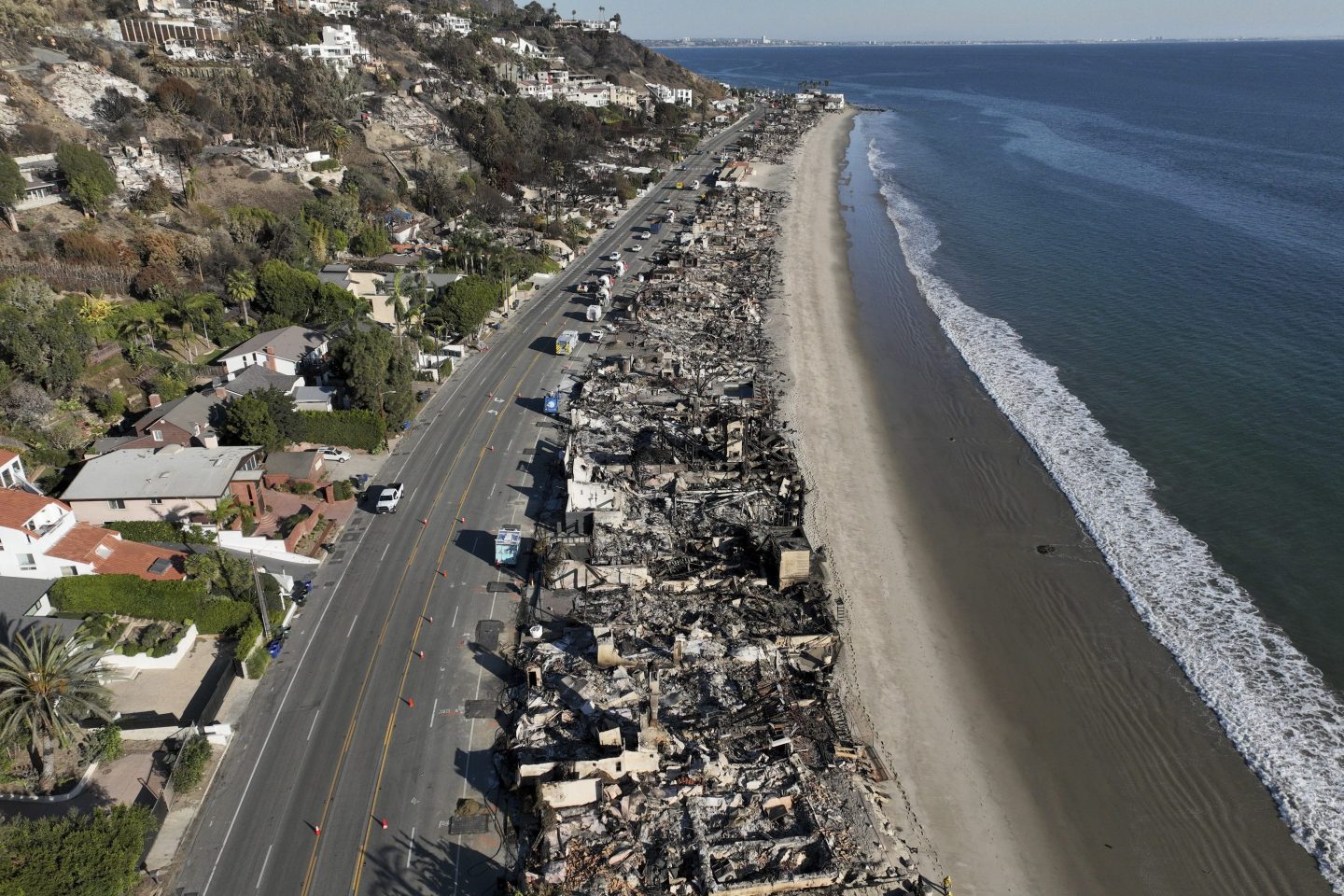 An aerial view shows the devastation from the Palisades Fire on beachfront homes on Jan. 15, 2025 in Malibu, Calif.