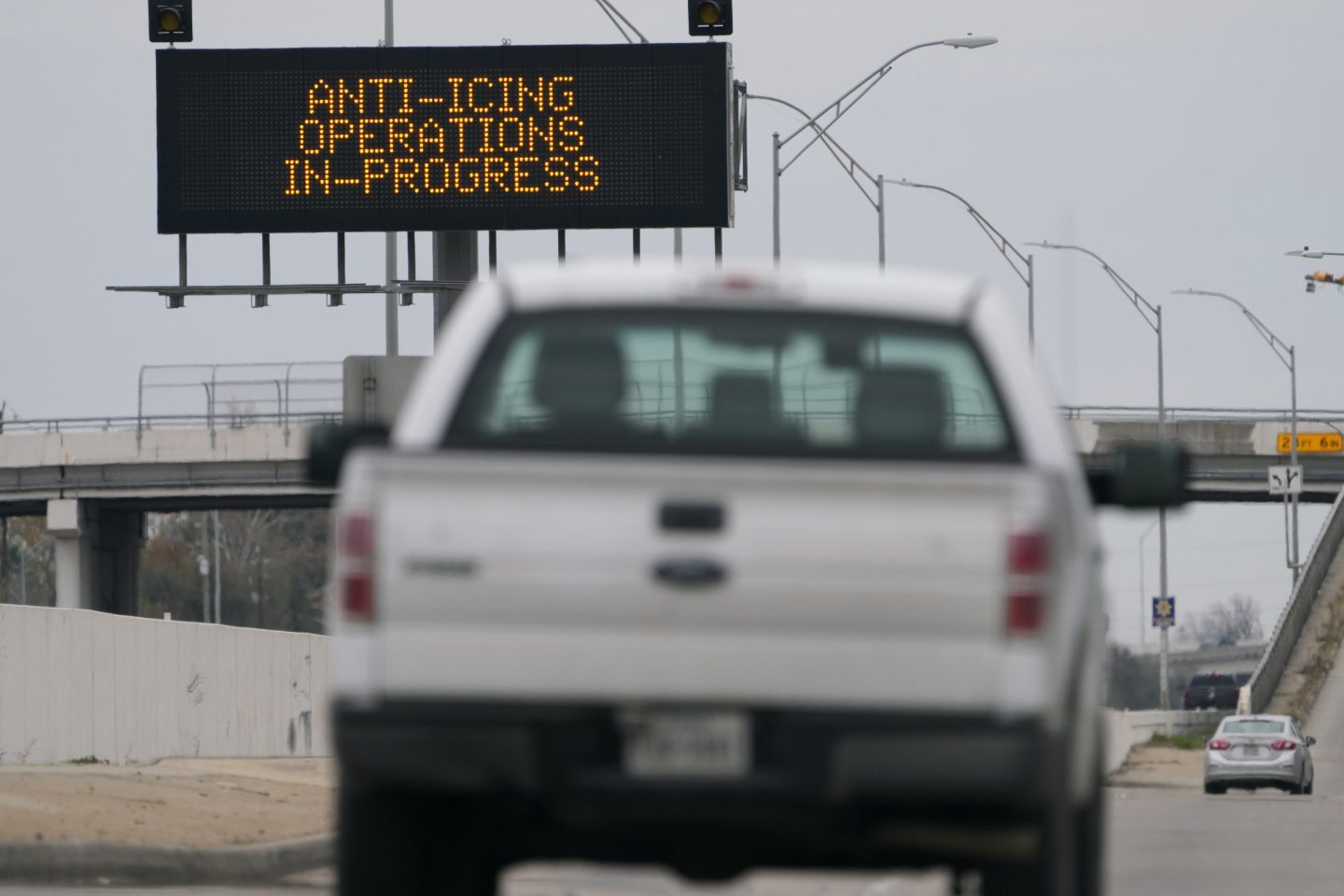 Vehicles pass a sign displaying Winter storm related operations on Jan. 20, 2025, in Houston, ahead of predicted several inches of snow and possibly ice in Southeast Texas.