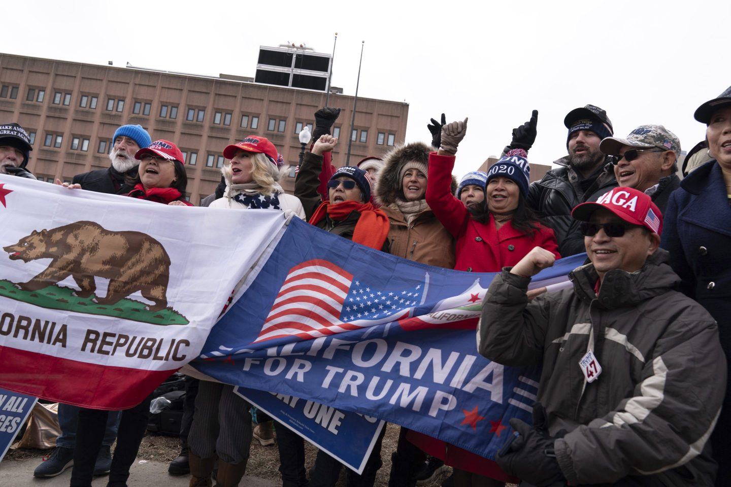 Supporters of President Donald Trump stand with their flags in support of people convicted for their part in the Jan. 6 riot at the U.S. Capitol at the DC Central Detention Facility in Washington, on Jan. 21, 2025.