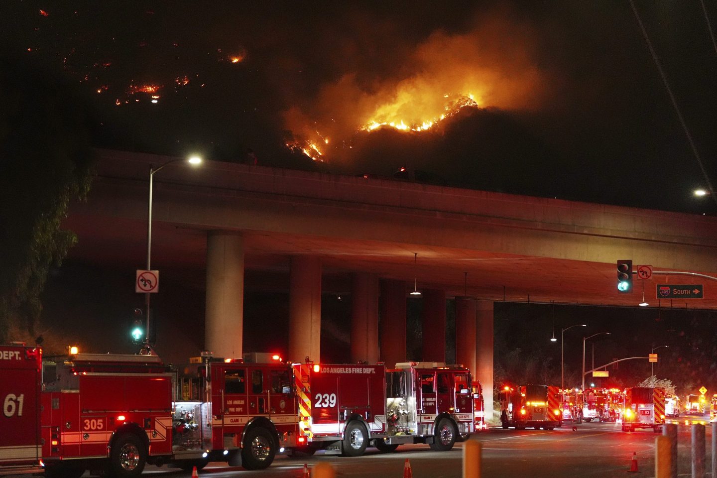 Apparatus sits on Sepulveda Blvd. as fire burns along Interstate 405, on Jan. 23, 2025, in Los Angeles.