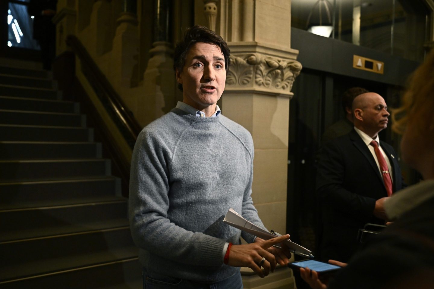 Canadian Prime Minister Justin Trudeau answers questions from reporters as he makes his way to a meeting of the Liberal caucus in West Block on Parliament Hill in Ottawa, on Jan. 23, 2025.