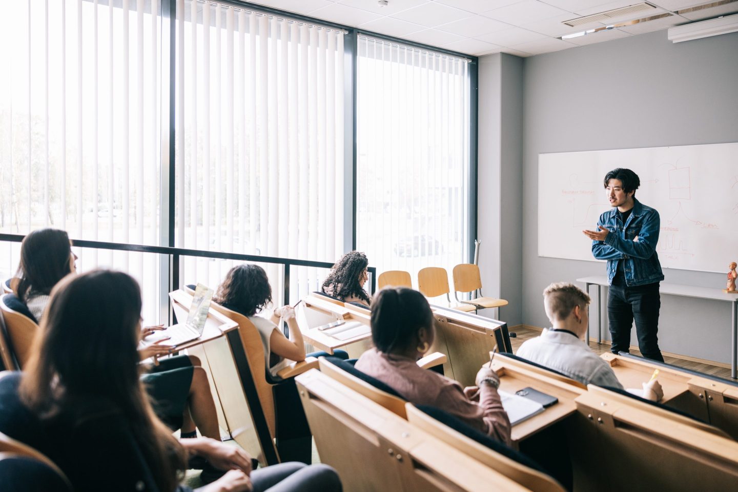 Group of students attending university seminar