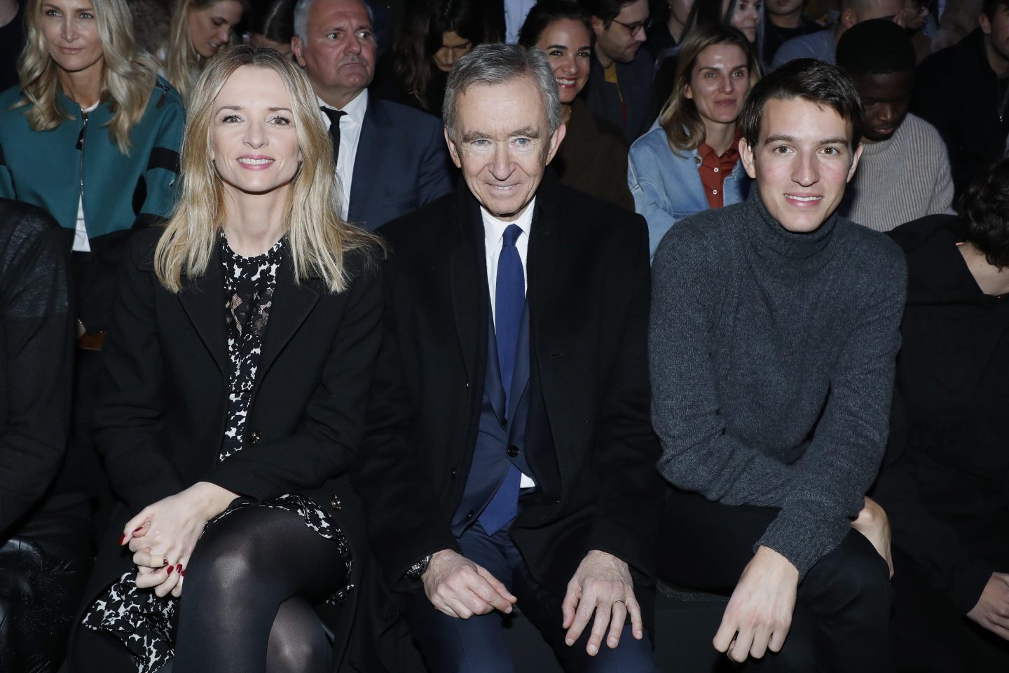 Owner of LVMH Luxury Group Bernard Arnault sitting between his daughter Louis Vuitton's executive vice president Delphine Arnault and his son CEO of Rimowa Alexandre Arnault attend the Louis Vuitton Menswear Fall/Winter 2019-2020 show as part of Paris Fashion Week on January 17, 2019 in Paris, France.