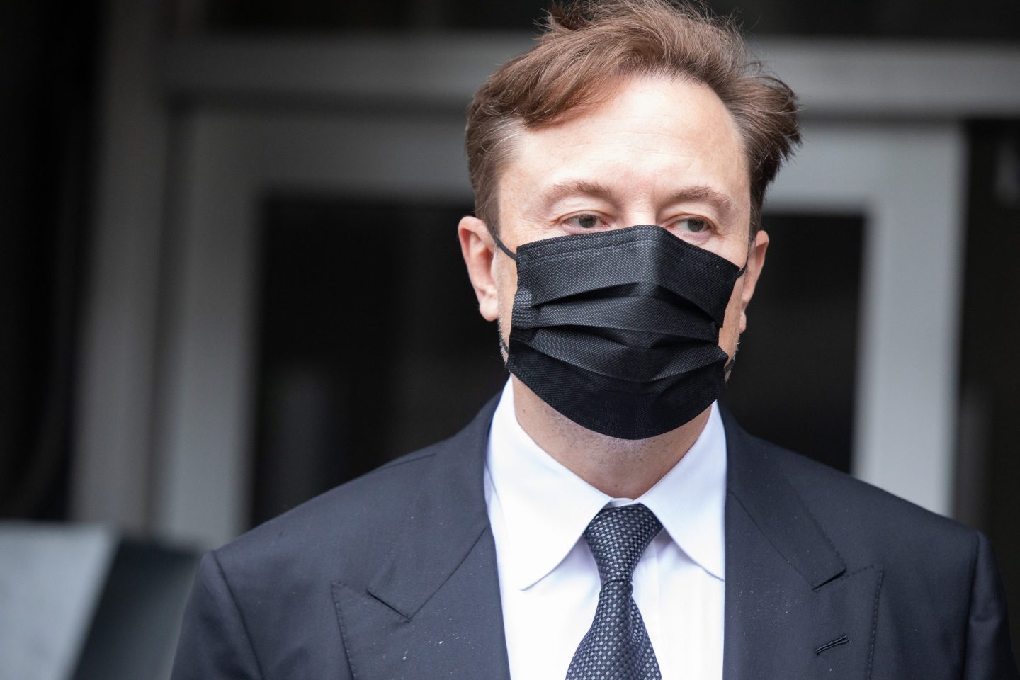 Elon Musk, chief executive officer of Tesla departs court in 2023.