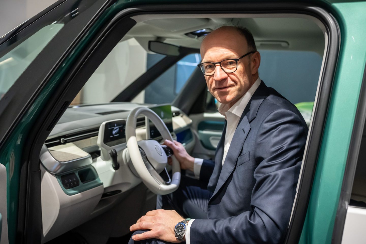Arno Antlitz, Chief Financial Officer (CFO) of Volkswagen AG, sits for a photo op in an ID after the annual press conference where the automaker's full 2022 financials were presented.