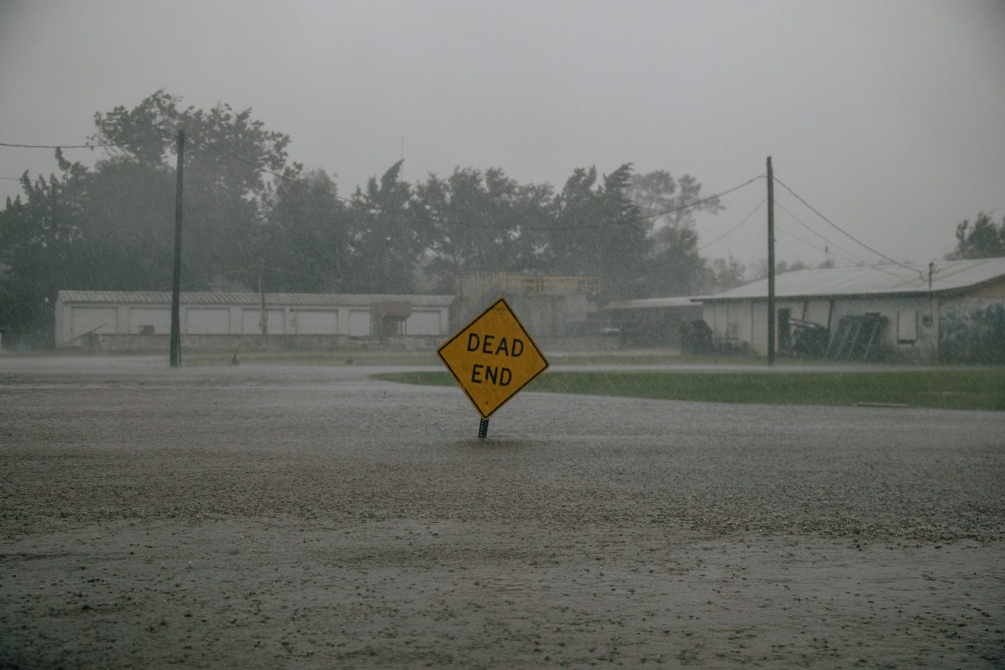 A traffic sign submerged in floodwater after Hurricane Delta made landfall in Louisiana.
