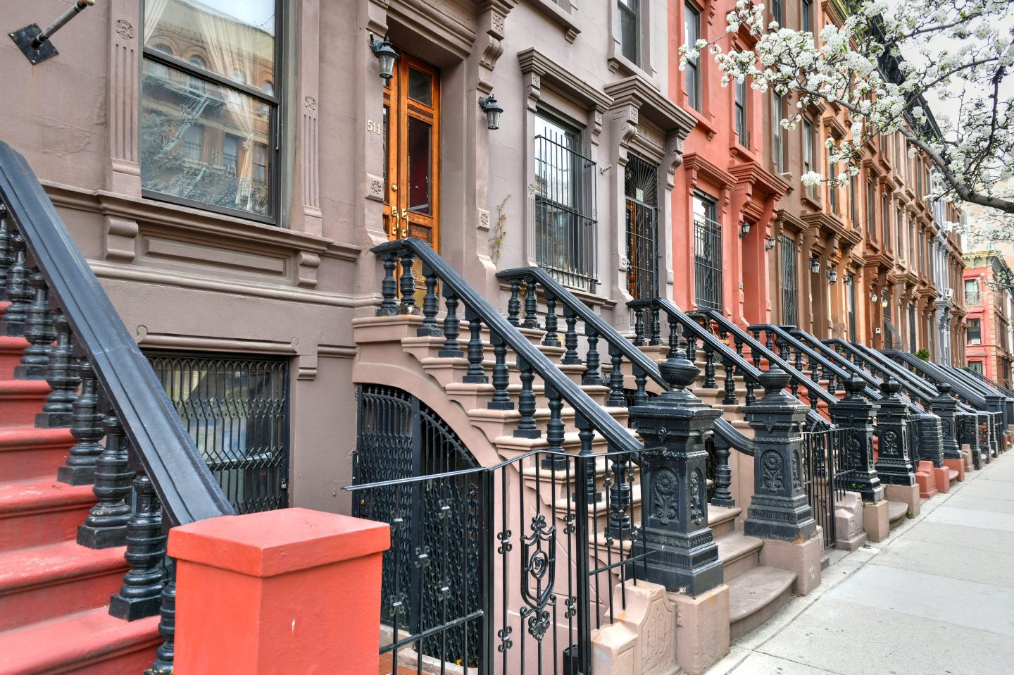 A street in New York City with Brownstone buildings.