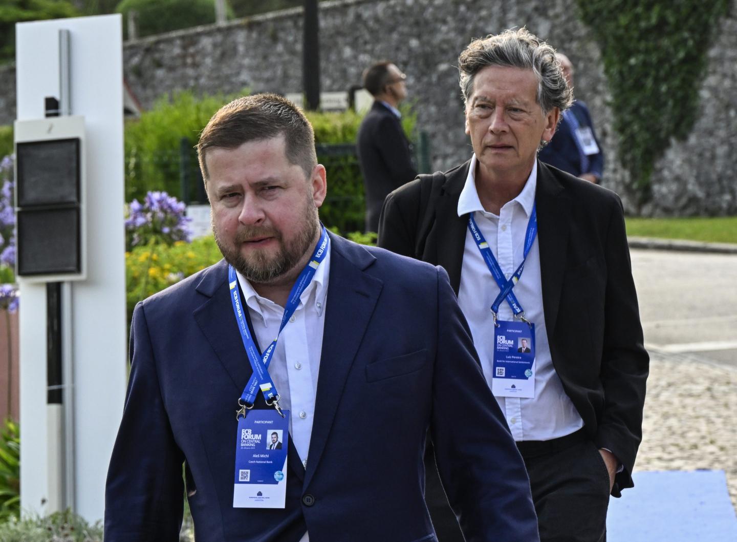 Governor of Czech National Bank Aleš Michl (L) and Luiz Awazu Pereira da Silva (R), Deputy General Manager at Bank for International Settlements, arrive to participate in the morning session during of the second day of the 2023 European Central Bank Forum on Central Banking on June 27, 2023, in Sintra, Portugal.