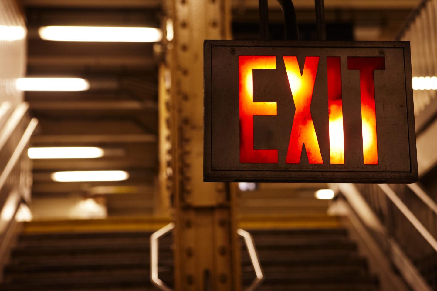 exit sign inside of a subway station