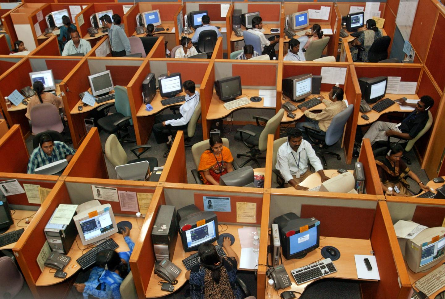 People working in cubicles.