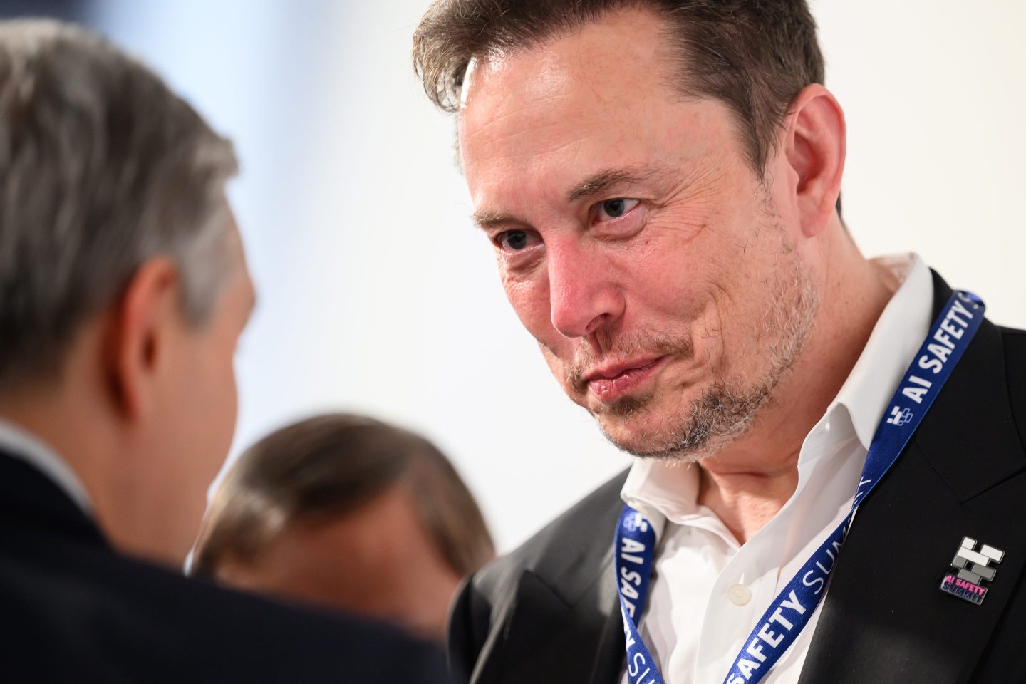 SpaceX, X (formerly known as Twitter), and Tesla CEO Elon Musk speaks with other delegates during day one of the AI Safety Summit at Bletchley Park on November 01, 2023 in Bletchley, England.