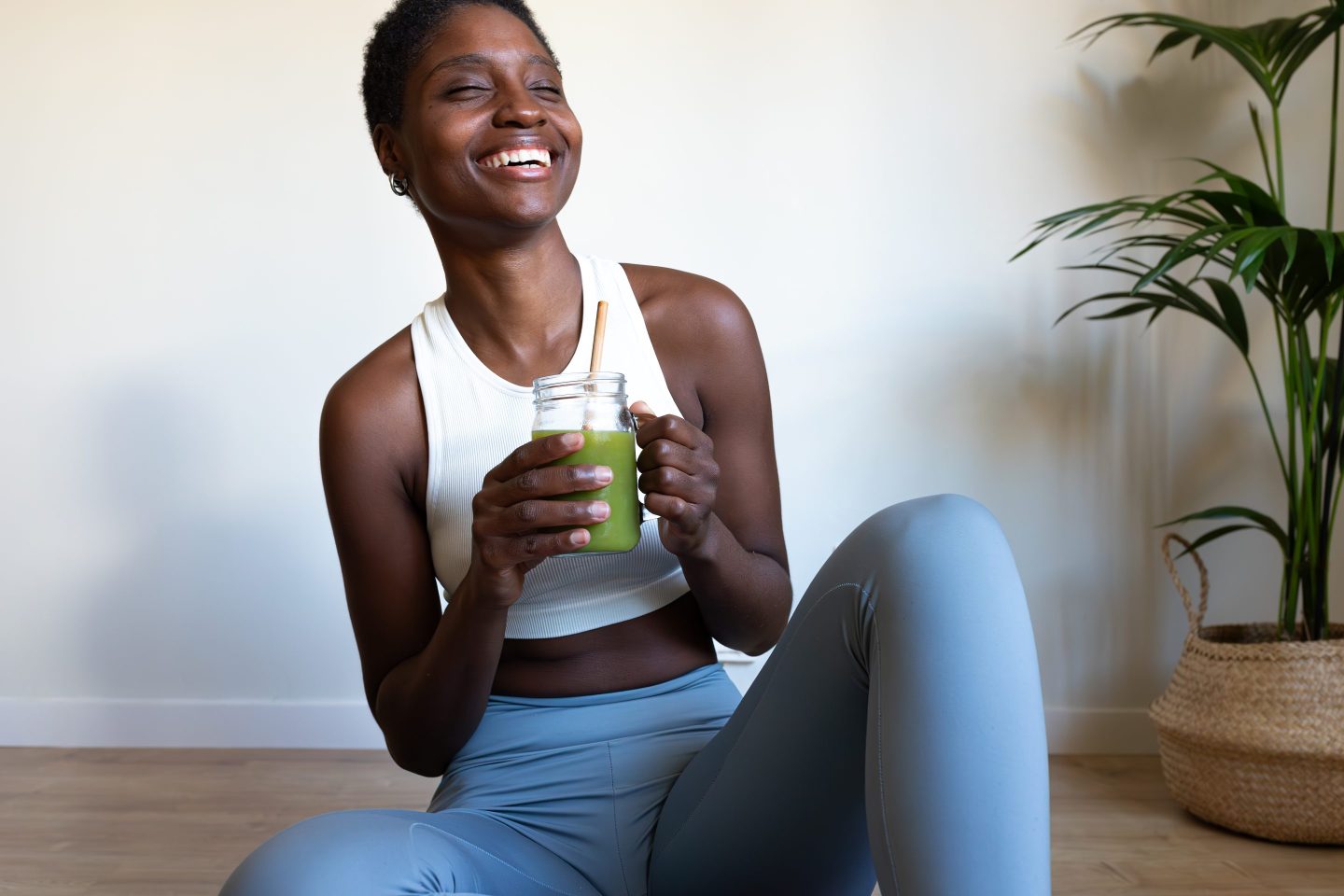 woman drinking green smoothie