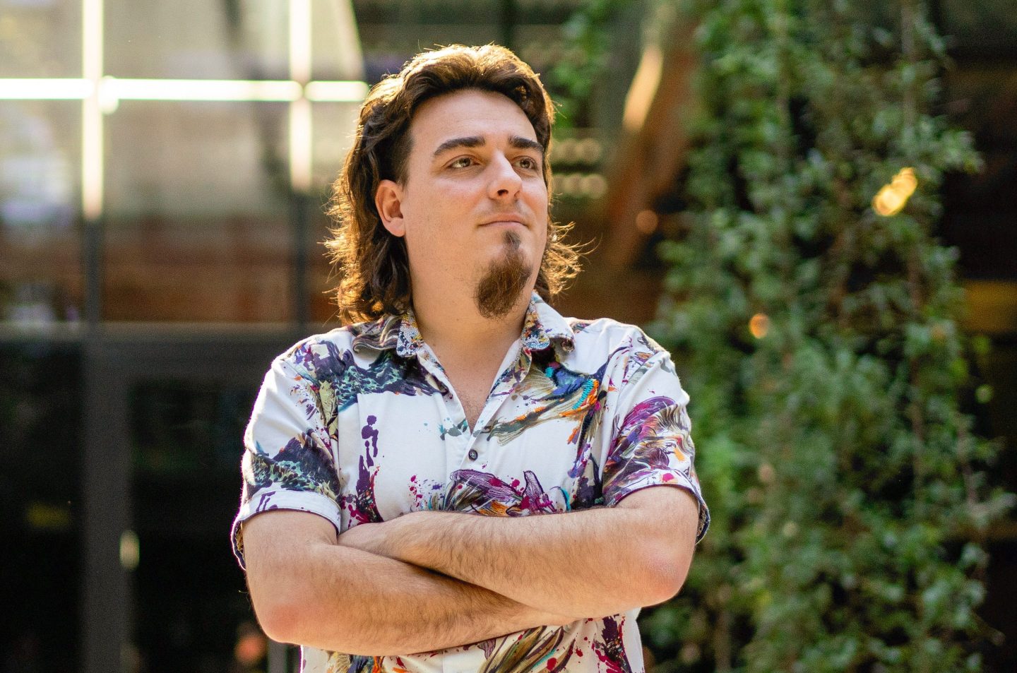 Palmer Luckey poses while crossing his arms
