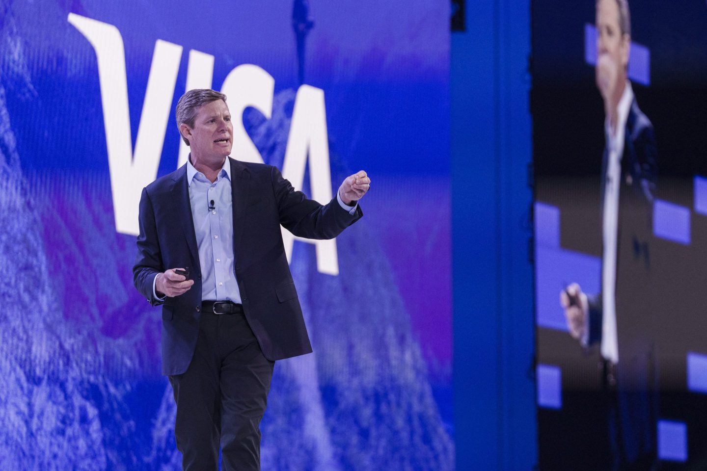 Ryan McInerney on stage at a VISA conference.