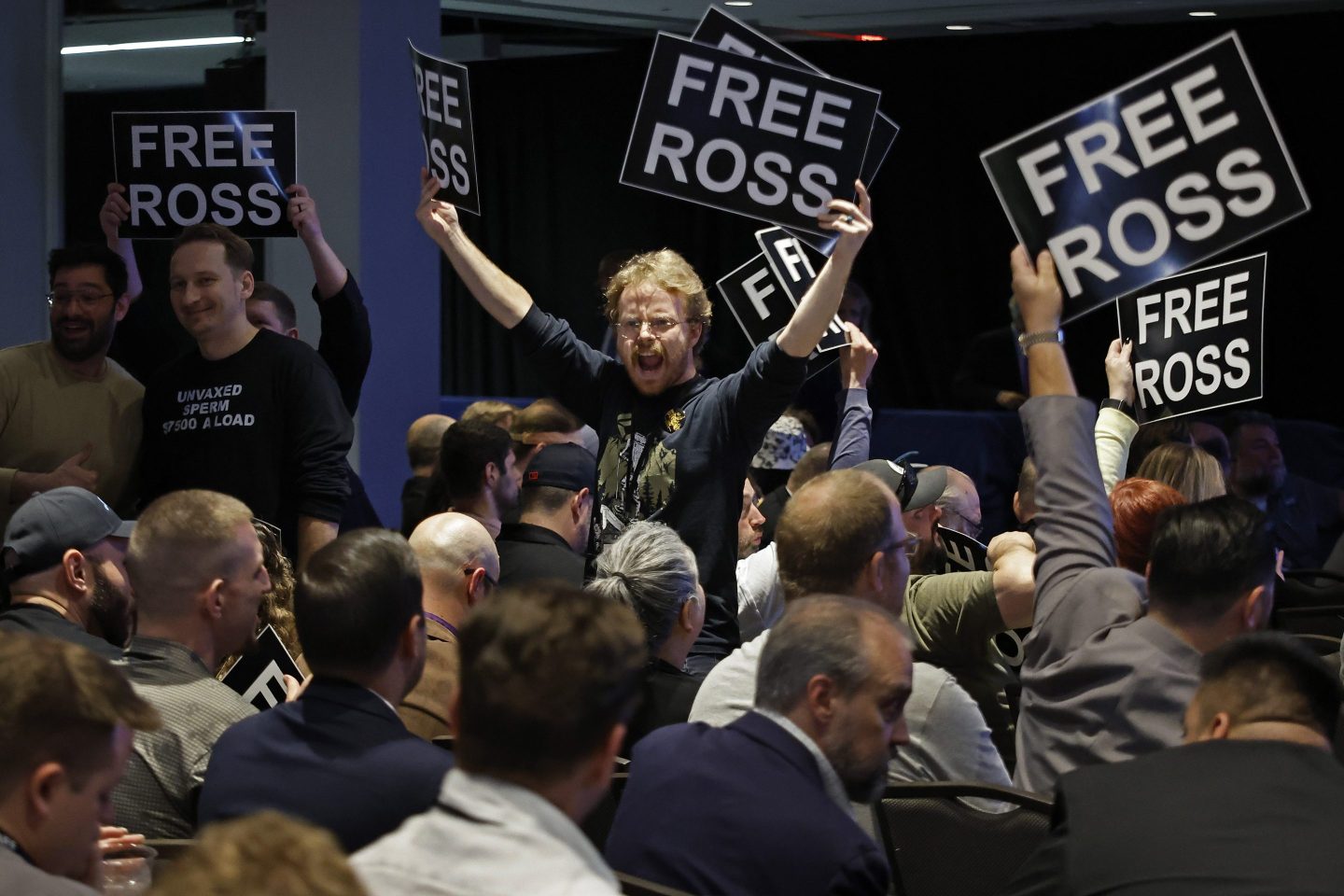 Members of the Libertarian Party stand in chairs while chanting and demanding the release of Ross Ulbricht during the party's national convention at the Washington Hilton on May 25, 2024 in Washington, DC.
