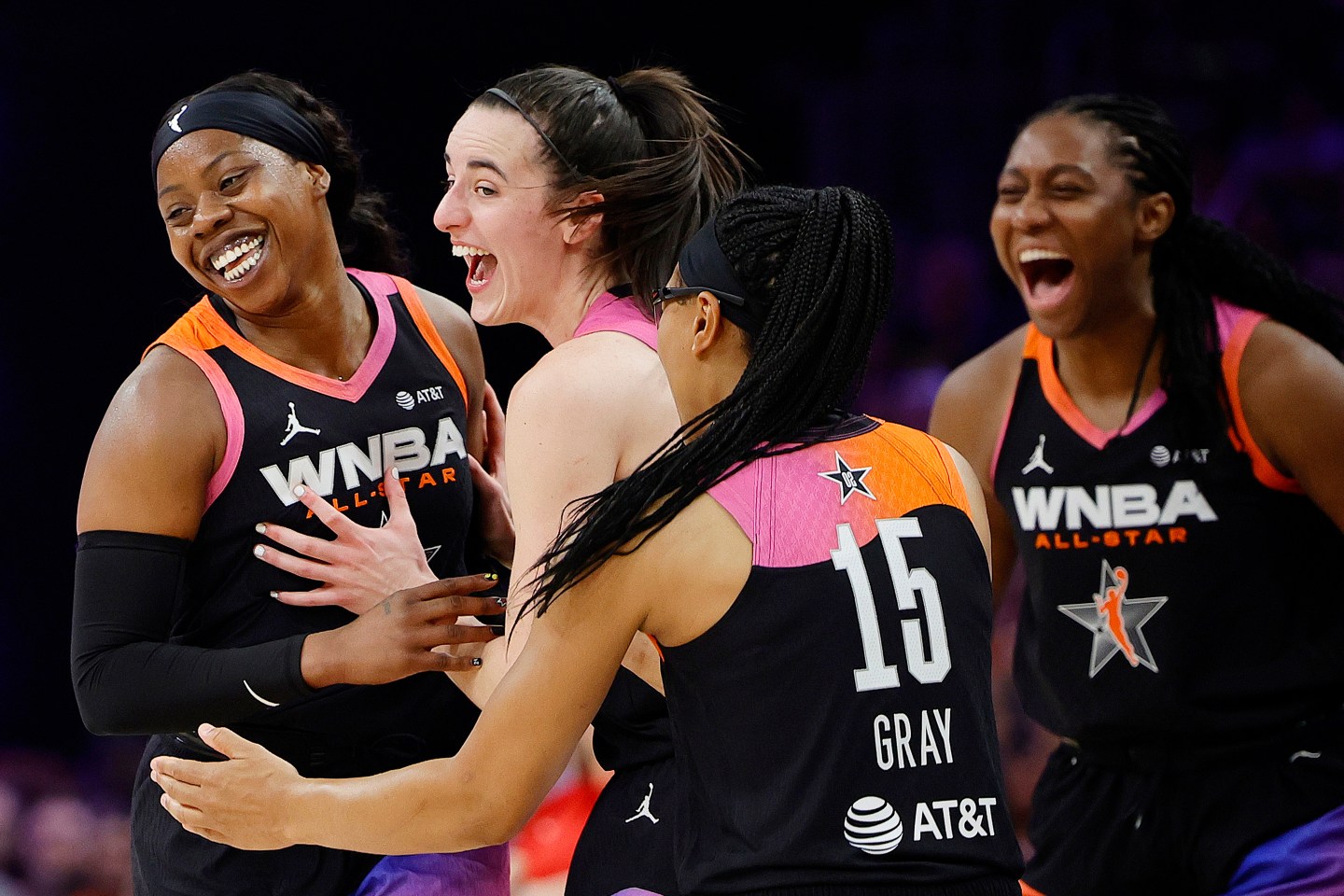 Arike Ogunbowale (24) celebrates a three point basket with Caitlin Clark (22) and Allisha Gray (15) of Team WNBA.