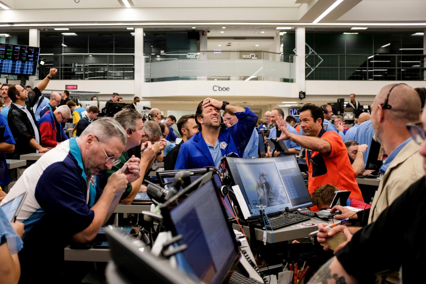 Traders work in the S&P options pit at the Cboe Global Markets exchange in Chicago