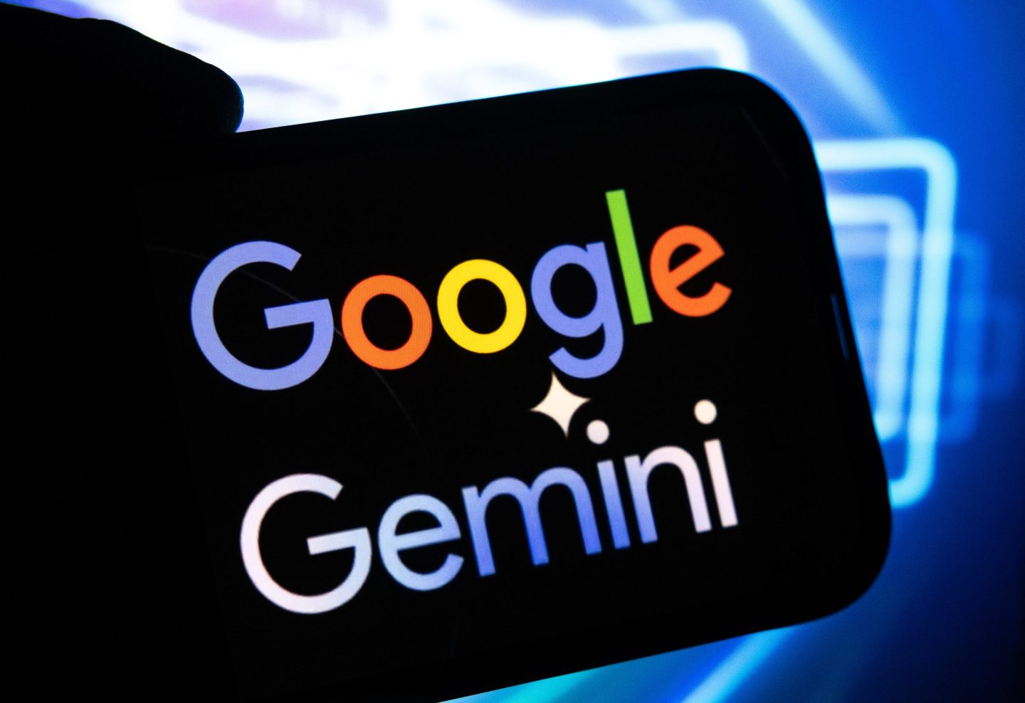 Photo of a mobile phone screen displaying the words Google Gemini