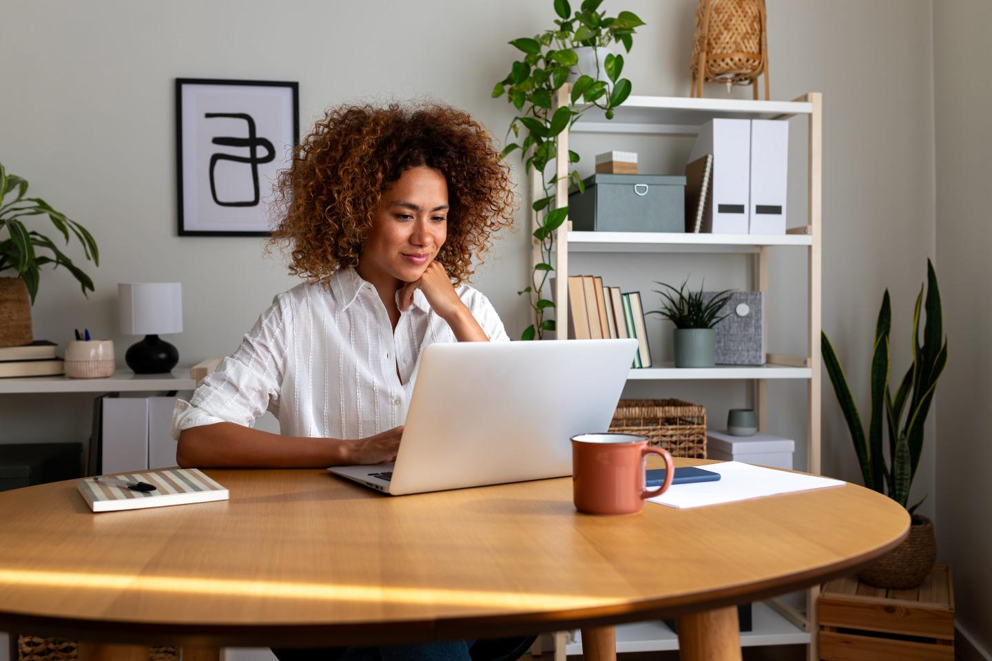 Employee happily works from home.