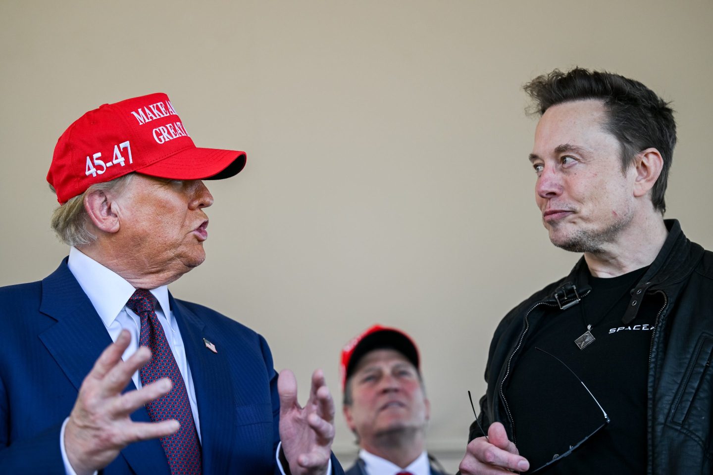 Elon Musk speaks with U.S. President-elect Donald Trump