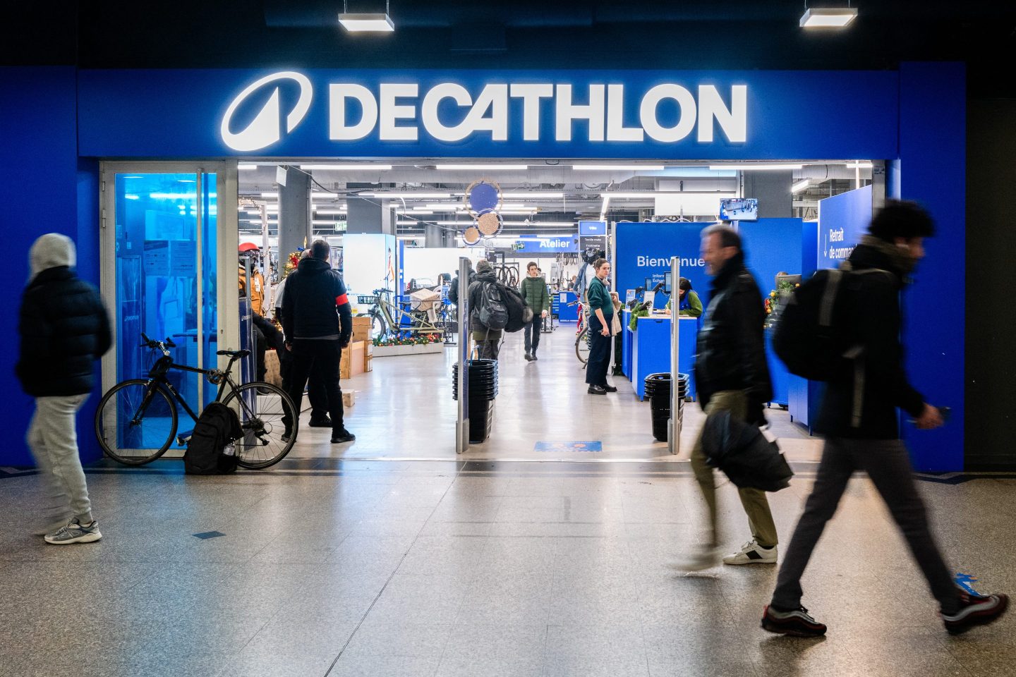 people walking outside a decathlon store