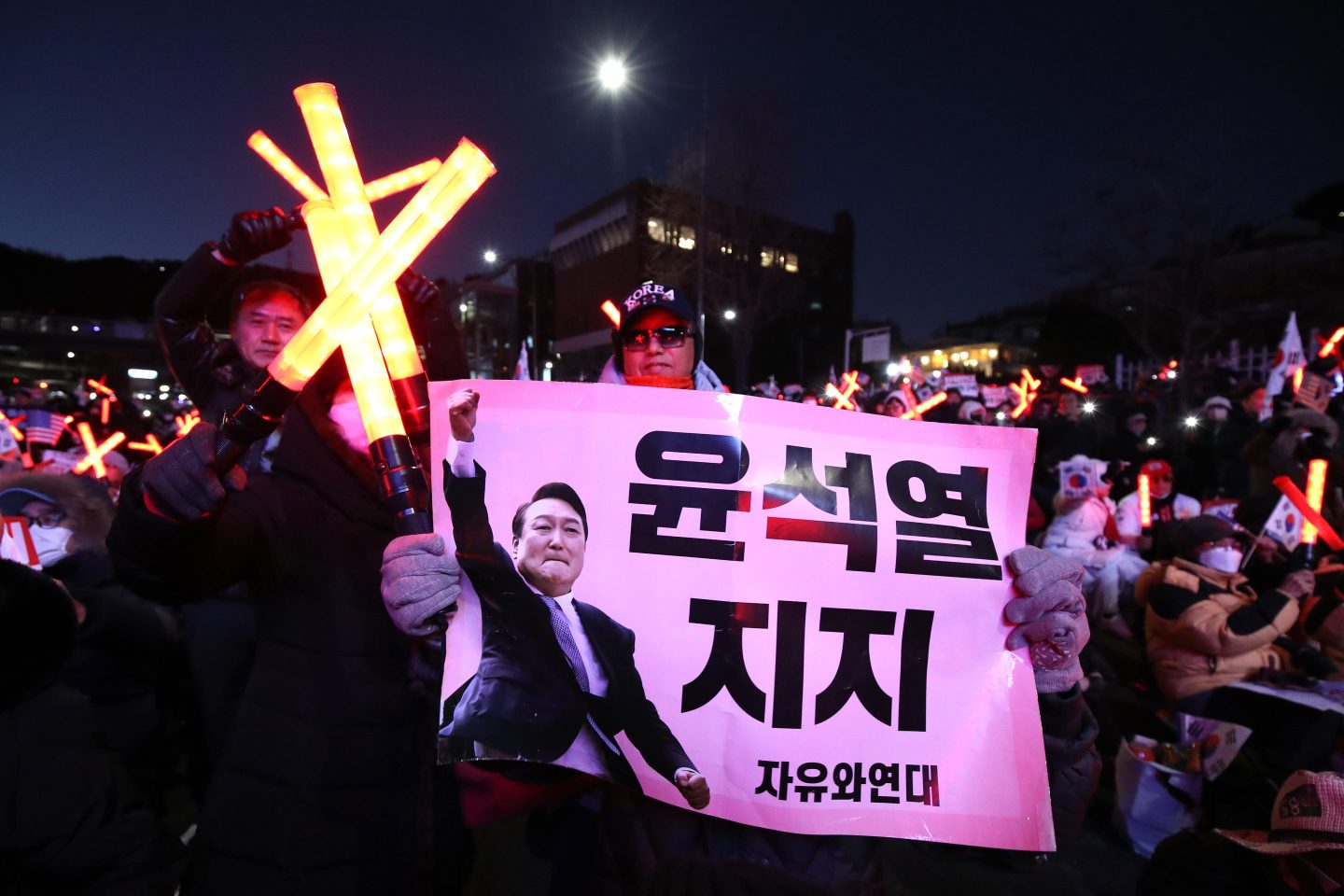Supporters of impeached South Korean President Yoon Suk Yeol stage a rally near the presidential residence on December 31, 2024 in Seoul, South Korea.