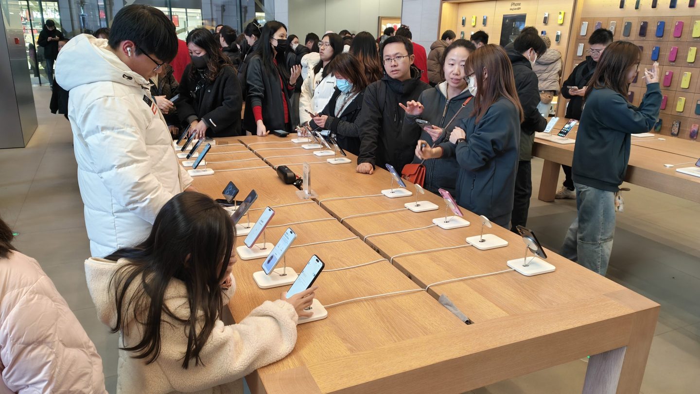 Consumers shop for the iPhone 16 series at an Apple flagship store in Shanghai on Jan. 4, 2025.