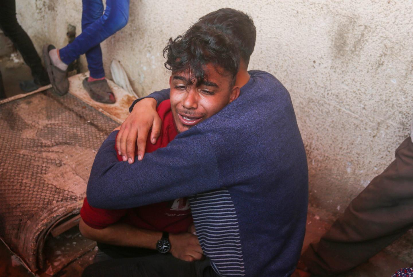 Palestinian relatives hug