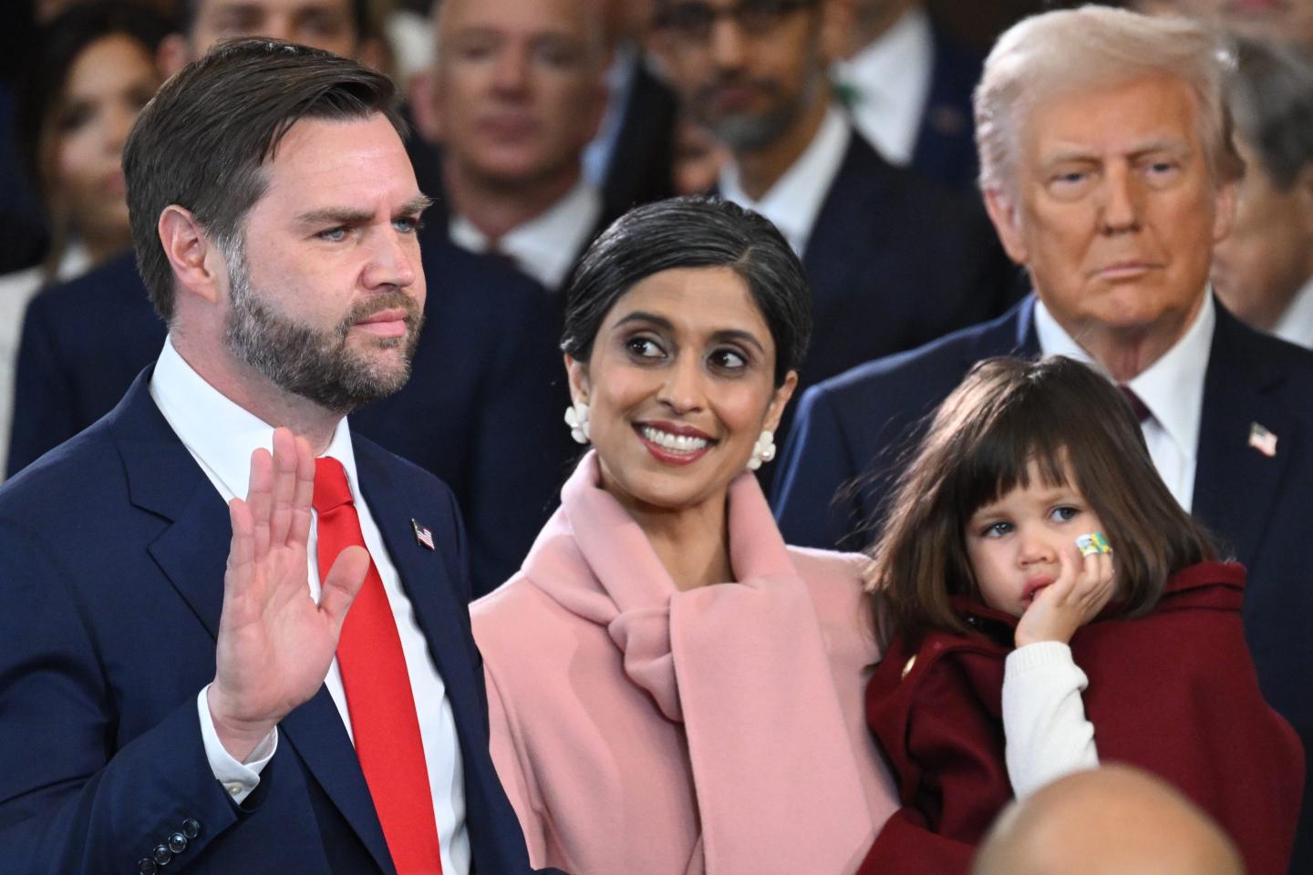 Usha Vance, center, watches as her husband J.D. Vance is sworn in as U.S. vice president on Monday.
