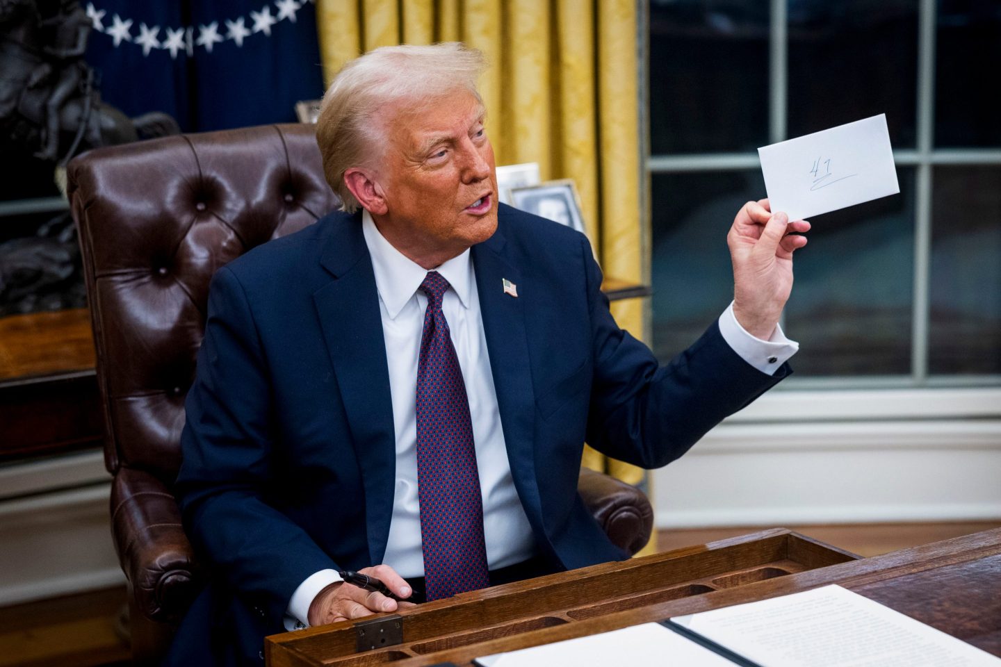 A reporter asked Trump if Biden had left him a note in the desk, a tradition during presidential transitions. Trump looked in a drawer and found an envelope.