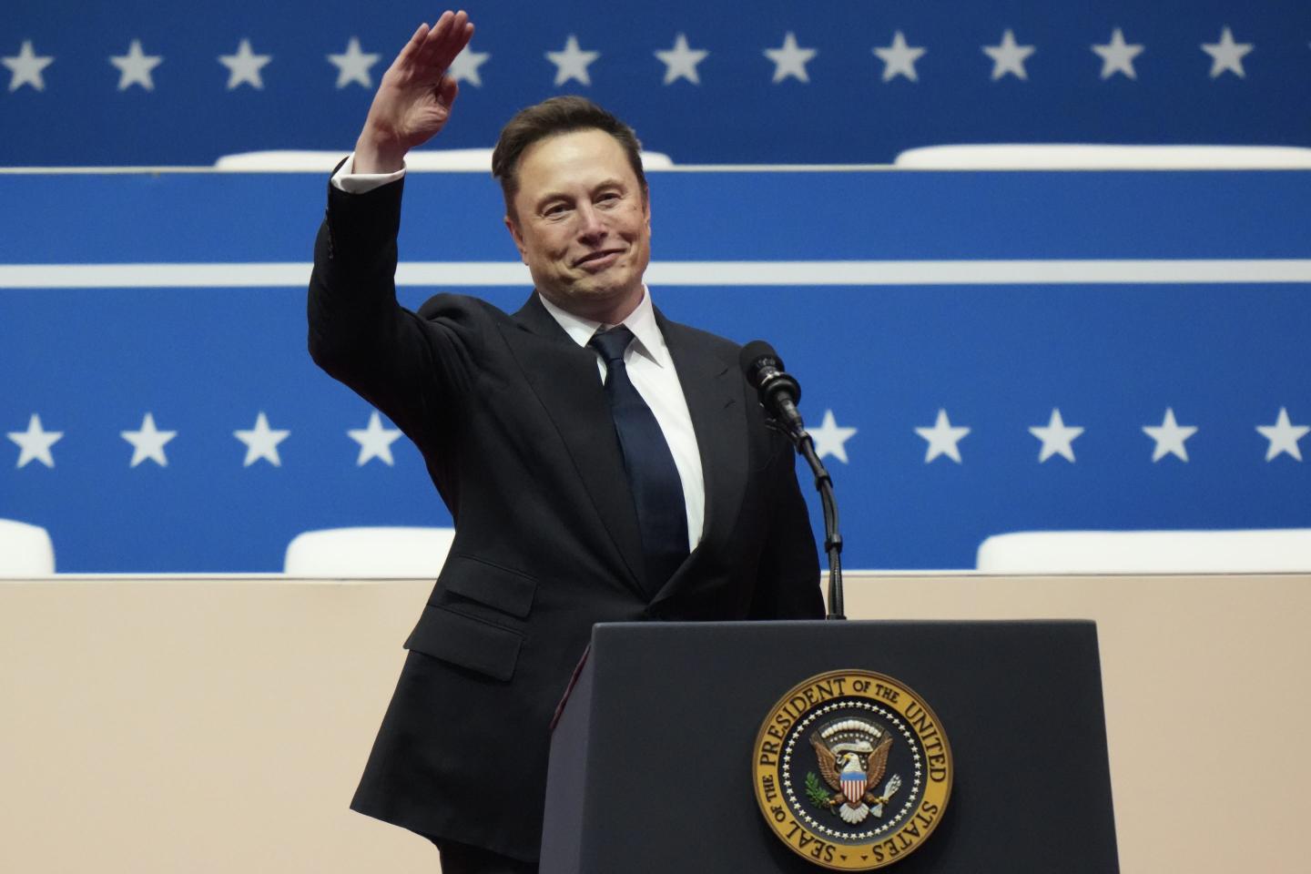 Tesla, SpaceX and X CEO Elon Musk gestures while speaking during an inauguration event at Capital One Arena