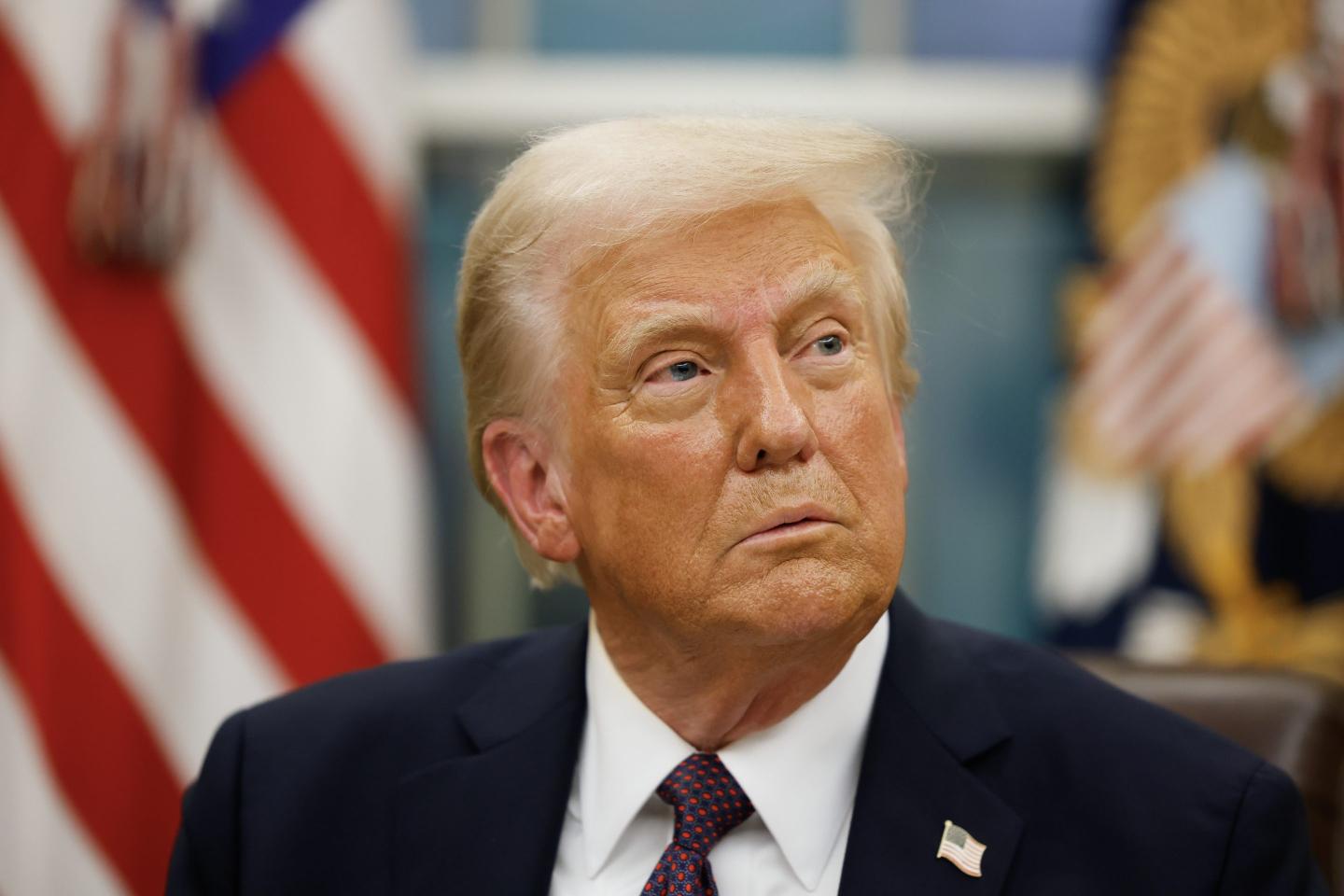 President Donald Trump signs executive orders in the Oval Office on January 20, 2025 in Washington, DC.