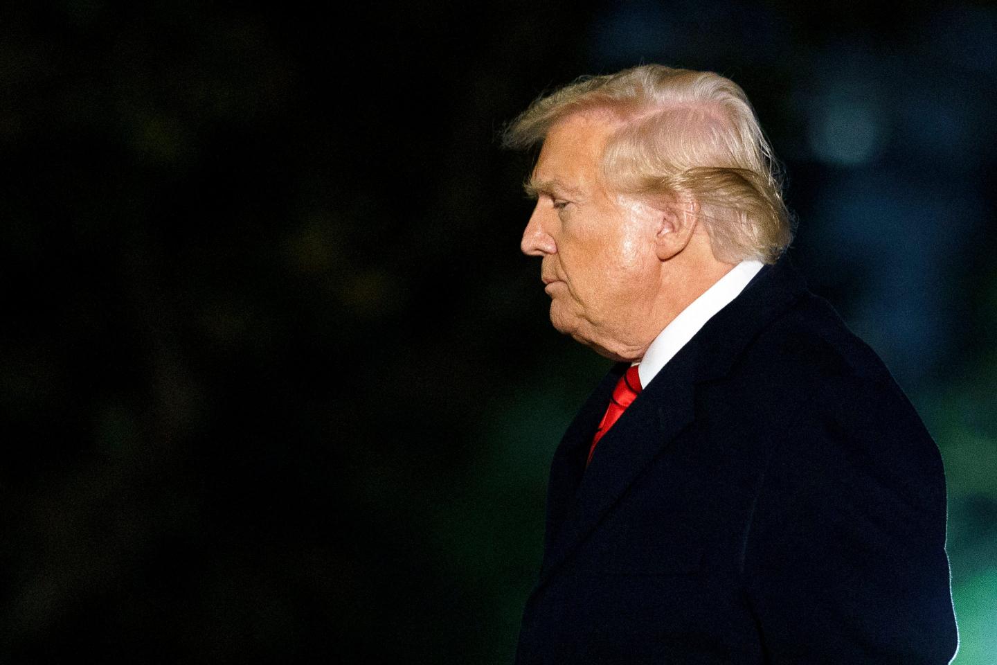 US President Donald Trump walks on the South Lawn of the White House