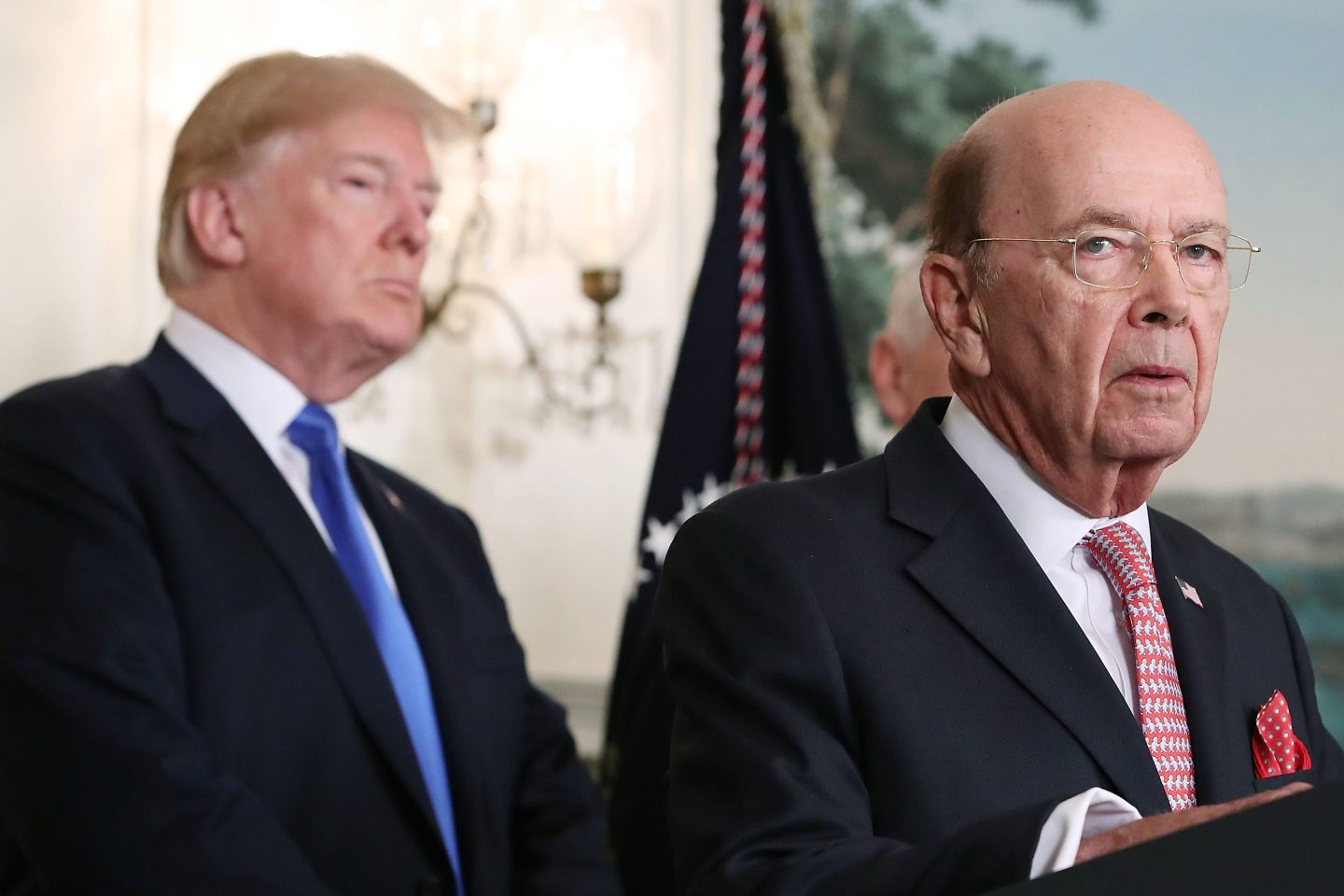 Former Commerce Secretary Wilbur Ross (R) speaks before U.S. President Donald Trump at the White House on March 22, 2018 in Washington, DC.