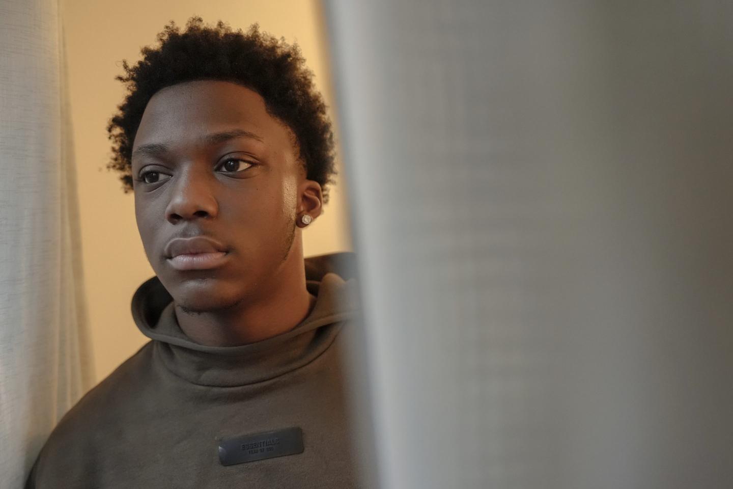 A teenage boy with a serious expression