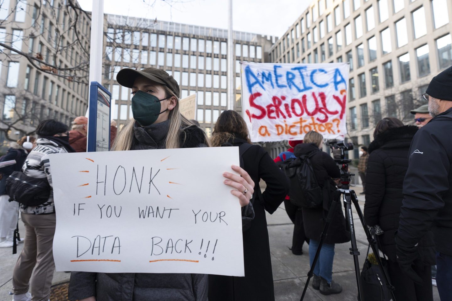 Protesters hold banners during a rally in front of the Office of Personnel Management, on Feb. 3, 2025, in Washington.
