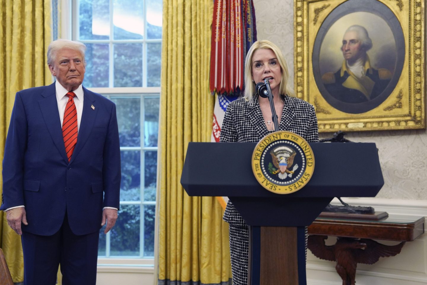 Attorney General Pam Bondi speaks after being sworn in by Supreme Court Associate Justice Clarence Thomas, in the Oval Office of the White House, on Feb. 5, 2025, in Washington, as President Donald Trump looks on.