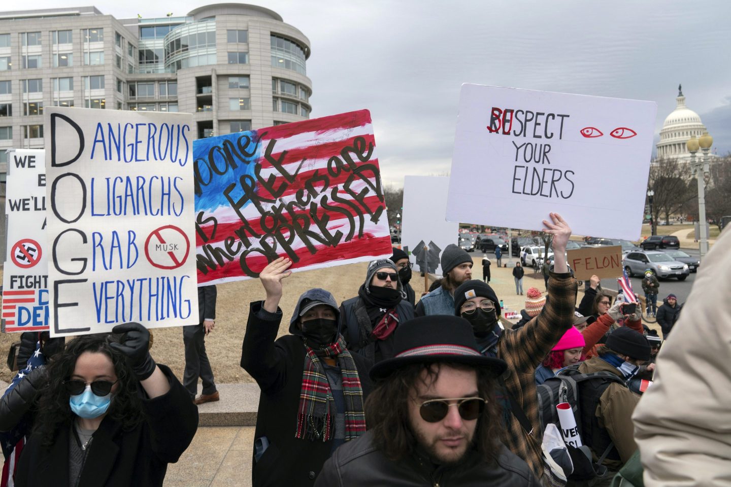 People protest during a rally against Elon Musk outside the U.S. Department of Labor in Washington, on Feb. 5, 2025.