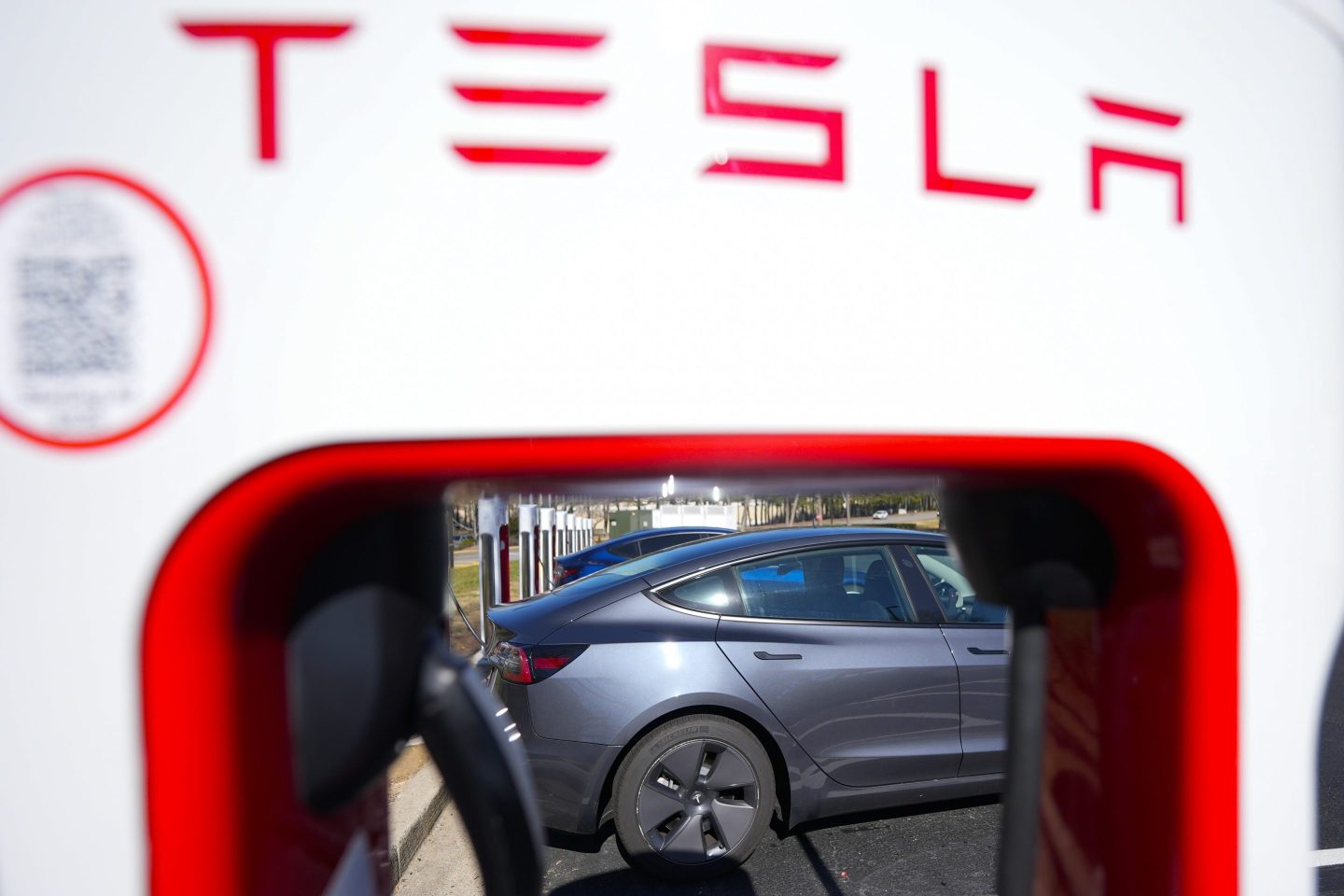 A Tesla level three Electric vehicle charger is visible, Feb. 2, 2024, in Kennesaw, Ga., near Atlanta.